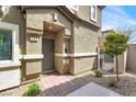 Charming front entrance featuring a brick walkway and well-manicured landscaping at 4625 Ridgeley Ave # 102, North Las Vegas, NV 89084