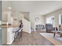 Open-concept living room featuring hardwood floors, stairs and lots of natural light at 4625 Ridgeley Ave # 102, North Las Vegas, NV 89084