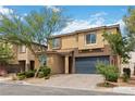 Beautiful two-story home with a charming exterior, well-kept landscaping, and a two-car garage at 5317 Golden Melody Ln, North Las Vegas, NV 89081