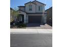 Charming two-story home with a two-car garage and a beautifully landscaped front yard at 7114 Superstar St, North Las Vegas, NV 89084
