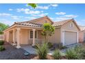 Beautiful one-story home featuring desert landscaping, a tile roof, and a covered porch at 7116 Wonderberry St, Las Vegas, NV 89131
