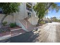 Charming building entrance with well-maintained landscaping and stairs leading to the main door at 725 N Royal Crest Cir # 246, Las Vegas, NV 89169
