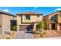 Beautiful two-story home with a two-car garage, landscaped front yard, and a welcoming entryway at 7714 Duran Harbor Ln, North Las Vegas, NV 89084