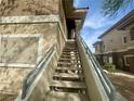 Exterior staircase leading to an upper-level unit with desert landscaping at 833 Aspen Peak Loop # 1021, Henderson, NV 89011