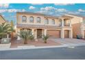 Inviting home boasting a three-car garage, front yard landscaping, and a lovely covered balcony at 8543 Alpine Vineyards Ct, Las Vegas, NV 89139