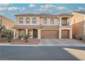 Charming two-story house featuring front yard landscaping, a three-car garage, and a cozy second-floor covered patio at 8543 Alpine Vineyards Ct, Las Vegas, NV 89139