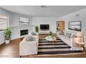 Bright, staged living room featuring a cozy fireplace, modern furnishings, and neutral color palette at 913 Boulder Springs Dr # 202, Las Vegas, NV 89128