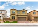 Two-story home with a brick driveway, lush green lawn, and a welcoming facade under a clear blue sky at 10372 Thurso Ave, Las Vegas, NV 89166