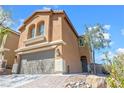 Charming two-story home with a two-car garage and desert-style landscaping for easy maintenance and curb appeal at 10624 Tuckermans Ave, Las Vegas, NV 89129