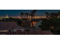Stunning Las Vegas city skyline view from rooftop featuring The Strip, palm trees, and nearby homes at 11037 Clarion Ln, Las Vegas, NV 89134