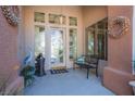 Charming front porch with decorative wreath, stylish decorations, and a bench, creating a welcoming atmosphere at 11037 Clarion Ln, Las Vegas, NV 89134
