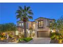 Elegant two-story home featuring a lush landscaped yard with mature trees and a private balcony at 11573 Glowing Sunset Ln, Las Vegas, NV 89135