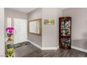 Inviting entryway features a tiled floor, mirror, and decor pieces at 11870 Tevare Ln # 1085, Las Vegas, NV 89138