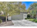 Charming two-story home with a well-maintained front yard and a spacious two car garage at 1348 Calle Montery St, Las Vegas, NV 89117