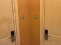 Hallway showing unit door numbers with contemporary design and fixtures at 135 E Harmon Ave # 3215, Las Vegas, NV 89109