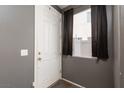 A welcoming foyer featuring a white door and neutral-toned walls at 1766 Molly Meadows St, Las Vegas, NV 89115