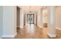 Grand foyer with soaring ceilings, stylish tile flooring and decorative double doors at 1779 Sebring Hills Dr, Henderson, NV 89052