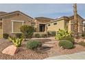 Charming home with meticulous desert landscaping, a brick walkway and mature plantings at 1779 Sebring Hills Dr, Henderson, NV 89052
