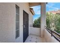 Welcoming entryway with tiled floor, secure entry door and view of exterior at 1830 N Buffalo Dr # 2043, Las Vegas, NV 89128