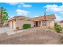 Charming single-story home featuring a two-car garage and desert landscaping at 206 Red Cloud Ter, Henderson, NV 89015