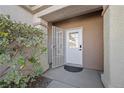 Inviting entryway featuring a secure screen door and a well-lit, covered porch at 2585 Shellsburg Ave, Henderson, NV 89052