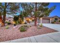 Well-maintained desert landscaping and charming courtyard adorn the front of this house at 2850 Thunder Bay Ave, Henderson, NV 89052