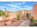 Beautiful backyard space with stone pavers, rock landscaping and lush greenery at 3306 Brookfield Dr, Las Vegas, NV 89120