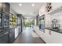 Modern kitchen with stainless steel appliances, dark countertops, and natural light at 3306 Brookfield Dr, Las Vegas, NV 89120