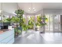 Bright sunroom filled with natural light, plants, and a view of the outdoors at 3306 Brookfield Dr, Las Vegas, NV 89120