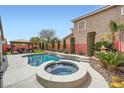 Private backyard featuring a pool, spa, mature landscaping and gazebo for outdoor relaxation and entertaining at 3728 Granada Gorge Ln, North Las Vegas, NV 89084