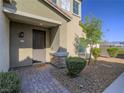 Inviting front entrance with a charming walkway, well-manicured bushes, and a 'hello' doormat at 3783 Canis Minor Ln # 6104, Henderson, NV 89052