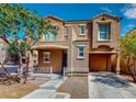Charming two-story home featuring a cozy front porch and convenient attached garage at 3820 Ice Storm Ct, Las Vegas, NV 89129
