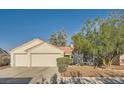 Charming single-story home with a two-car garage and desert landscaping at 4620 Standing Bluff Way, Las Vegas, NV 89130