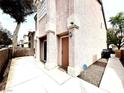 Side view of the home with a door and pathway at 5359 Harvest Breeze Rd, Las Vegas, NV 89118