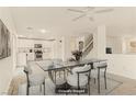 Open dining area adjacent to the kitchen, featuring modern furniture at 6480 Chebec St, North Las Vegas, NV 89084