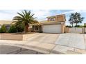 Charming two-story home featuring a well-manicured front yard and a two car garage at 730 Rusty Spur Dr, Henderson, NV 89014