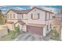 Stylish two-story home with a tile roof, archway, and attached garage, creating curb appeal at 759 Sunrise Crossing St, Henderson, NV 89014