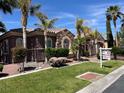 Beautiful single-story home featuring manicured landscaping, stone accents, and a tile roof at 8209 Chapelle Ct, Las Vegas, NV 89131
