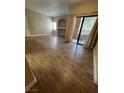 A large living room area featuring tile floors, built-in shelves and access to a balcony at 8250 N Grand Canyon Dr # 1121, Las Vegas, NV 89166