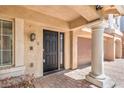 Inviting front entrance featuring a black door, brick pathway, and well-maintained landscaping at 8454 Mondavi Hill Ct, Las Vegas, NV 89139