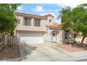 Charming two-story home featuring a well-manicured lawn and a spacious two-car garage at 9416 Rolling Ridge Ln, Las Vegas, NV 89134