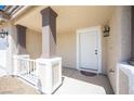 Welcoming front door with decorative columns, charming lighting fixtures, and a cozy entrance at 9750 W Cherokee Ave, Las Vegas, NV 89147