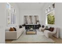 Bright living room with high ceilings, modern decor, and plenty of natural light at 134 Wentworth Dr, Henderson, NV 89074
