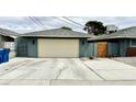 This home features a spacious garage and wide driveway at 1801 Griffith Ave, Las Vegas, NV 89104