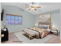 Relaxing bedroom offers a ceiling fan, plush bed, and natural light from the window at 681 Peach Coral St, Las Vegas, NV 89183