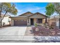 Charming single-story home featuring a well-manicured front yard and a two car garage at 7806 Sundial Peak St, Las Vegas, NV 89166