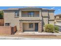 Home with a gated front entry, a covered front porch, and desert landscaping at 7865 Solid Horn Ct, Las Vegas, NV 89149