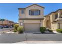 This shot focuses on the garage and front door of a two-story home with desert landscaping at 7865 Solid Horn Ct, Las Vegas, NV 89149