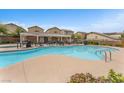 Community pool with plenty of lounge chairs and tables, perfect for relaxation at 7865 Solid Horn Ct, Las Vegas, NV 89149