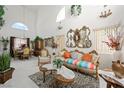 Elegant living room with high ceilings, ornate furniture, and an abundance of natural light at 9021 Canyon Magic Ave, Las Vegas, NV 89129